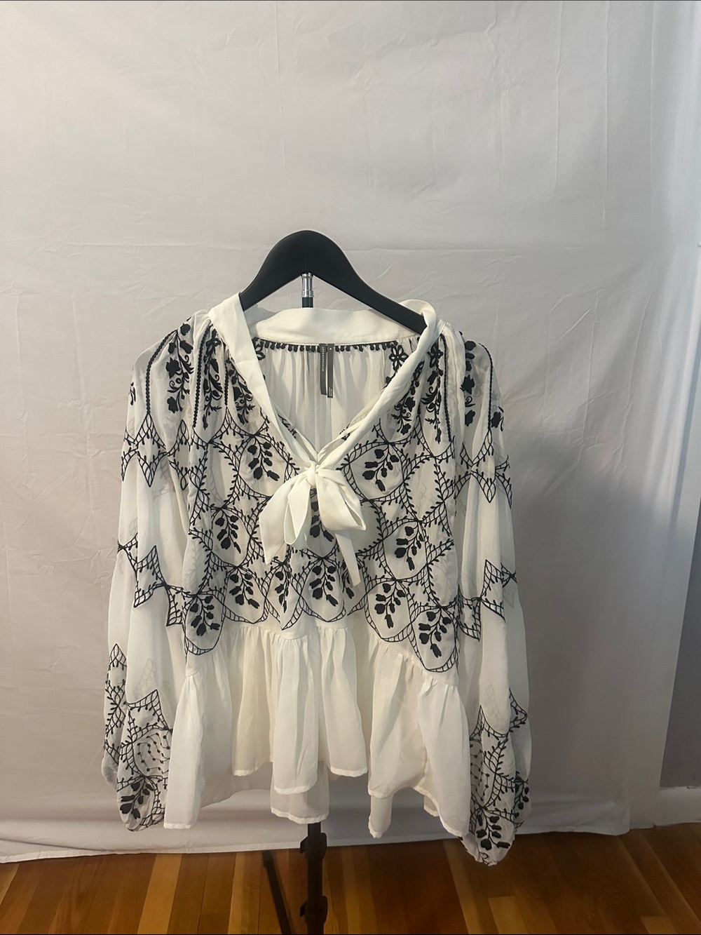 Anthropologie White Blouse with Black Floral Embroidery and Tie Neck